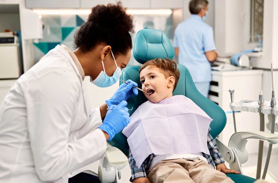 At what age should your kid see a dentist for the first time?